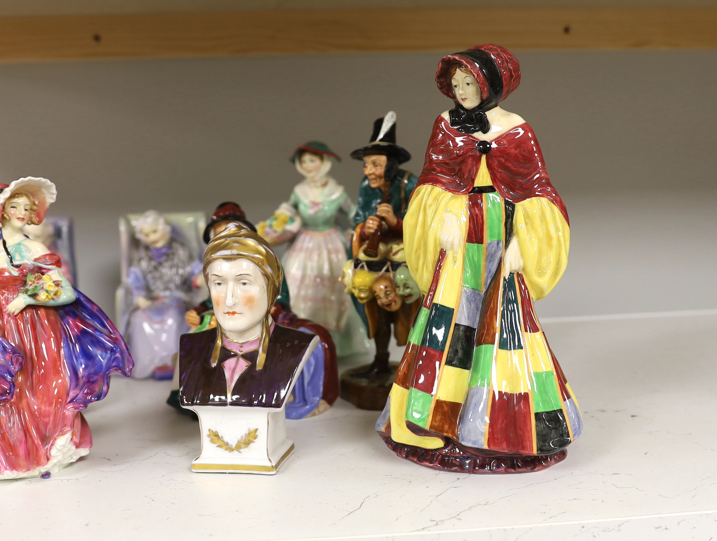 Eleven Royal Doulton porcelain figures including; The Potter HN1493, The Orange Lady HN1759, Daffy-Down-Dilly, etc. tallest 25cm, and a Continental porcelain bust (12)